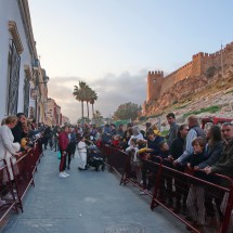 Excited crowd on the street below the Alcazaba